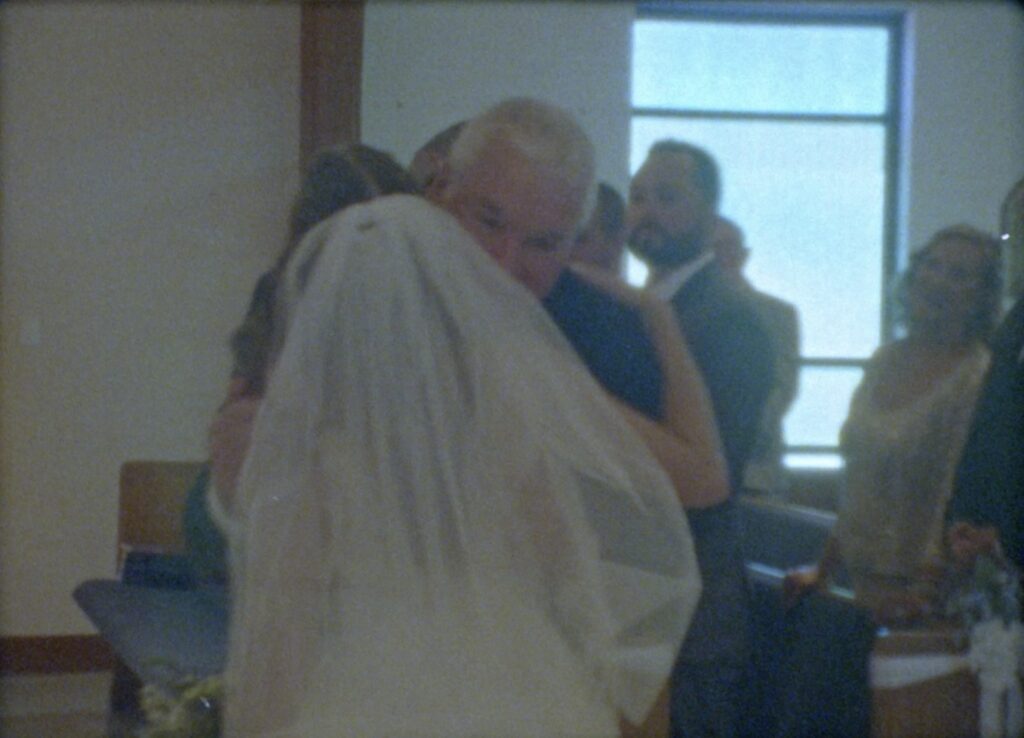 father handing off bride at church wedding in new jersey on super 8 in philadelphia