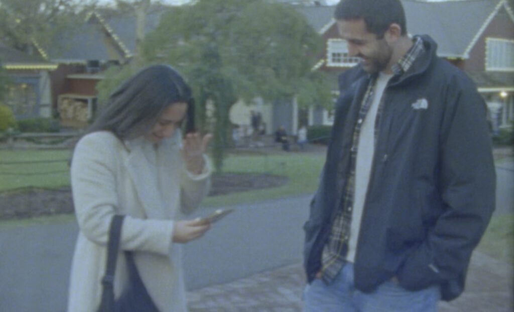 couple newly engaged caught on super 8 film in peddlers village